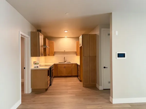 an empty room with wooden floor