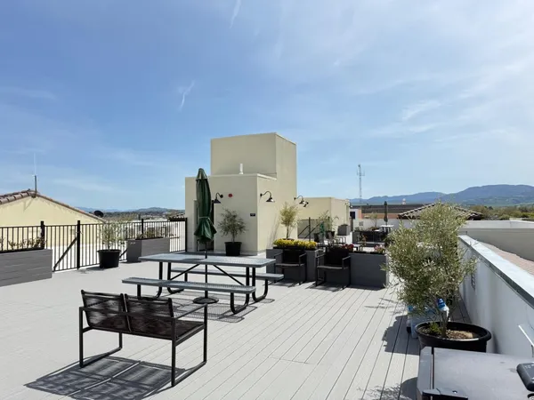 a view of a terrace with seating area