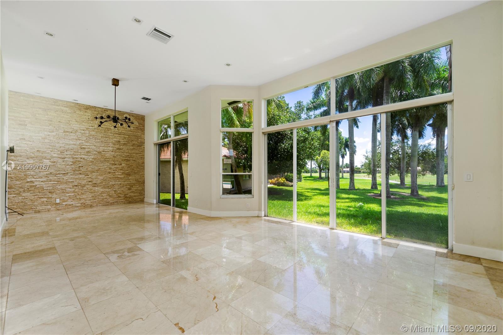 2467 Eagle Run Drive Weston, FL 33327 - Photo 11 of 33 a view of an entryway with a garden and yard