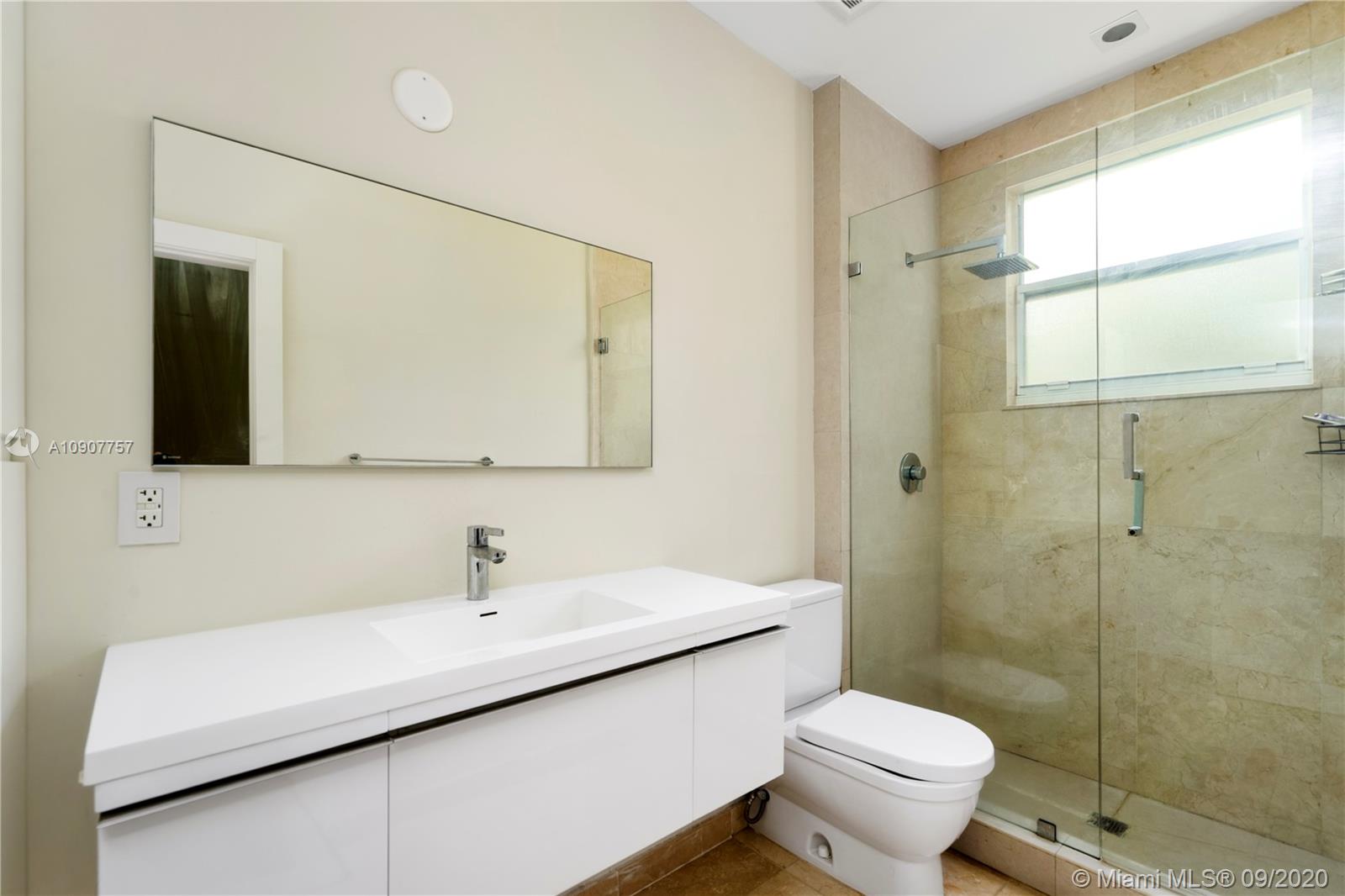 2467 Eagle Run Drive Weston, FL 33327 - Photo 18 of 33 a bathroom with a sink a toilet and shower