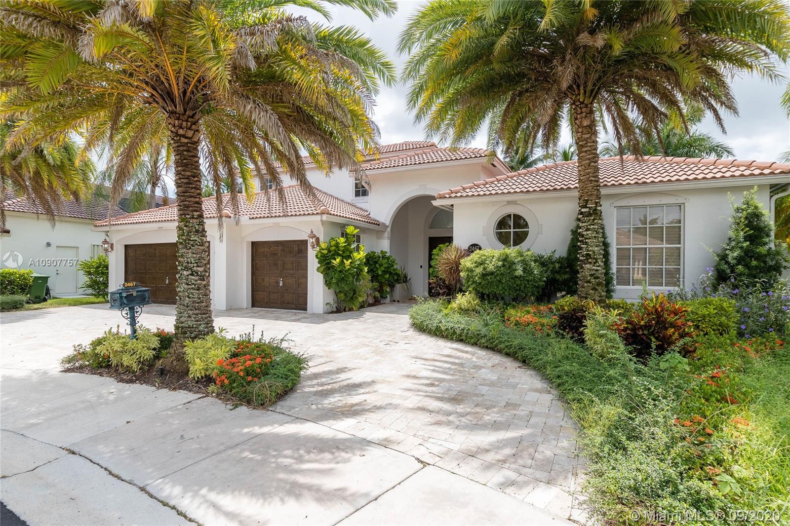 2467 Eagle Run Drive Weston, FL 33327 - Photo 2 of 33 a front view of house with yard and green space