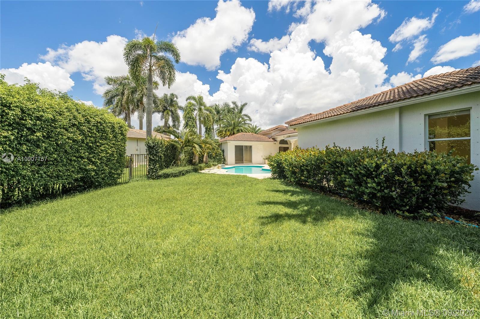 2467 Eagle Run Drive Weston, FL 33327 - Photo 22 of 33 a view of a house with a backyard