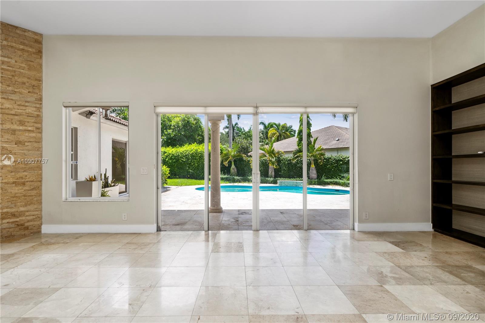 2467 Eagle Run Drive Weston, FL 33327 - Photo 8 of 33 a view of an empty room with a floor to ceiling window and floor to ceiling window
