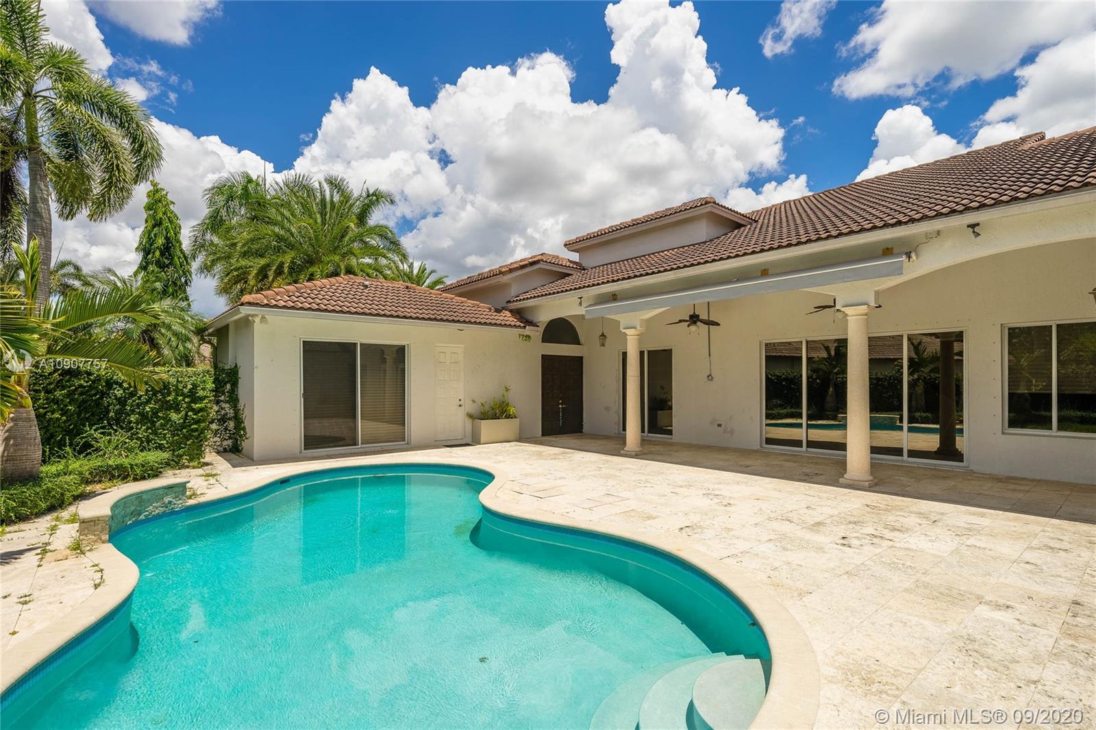 2467 Eagle Run Drive Weston, FL 33327 - Photo 10 of 33 a front view of a house with garden