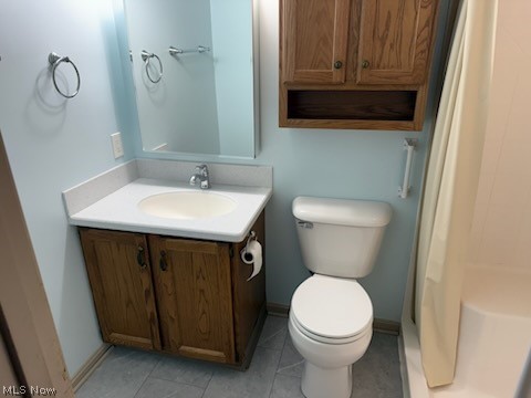 97 Park Road Painesville, OH 44077 - Photo 11 of 18 Full bathroom with vanity, a shower with shower curtain, and light tile patterned floors