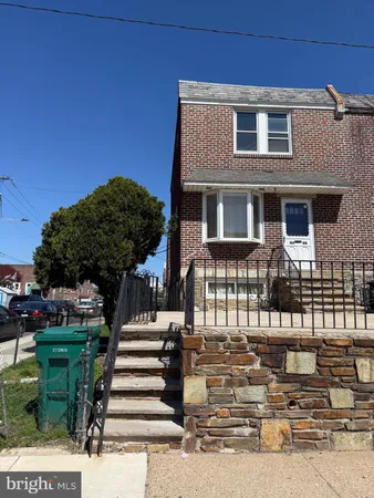 a front view of a house with stairs