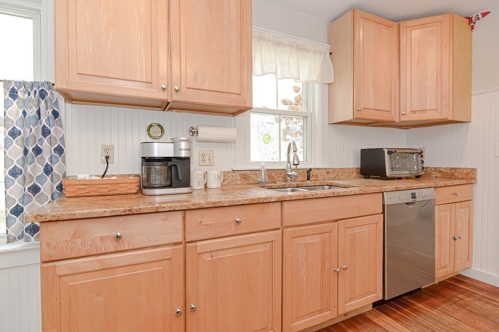 103 Maple Avenue Rutland, MA 01543 - Photo 12 of 42 a kitchen with granite countertop white cabinets and sink