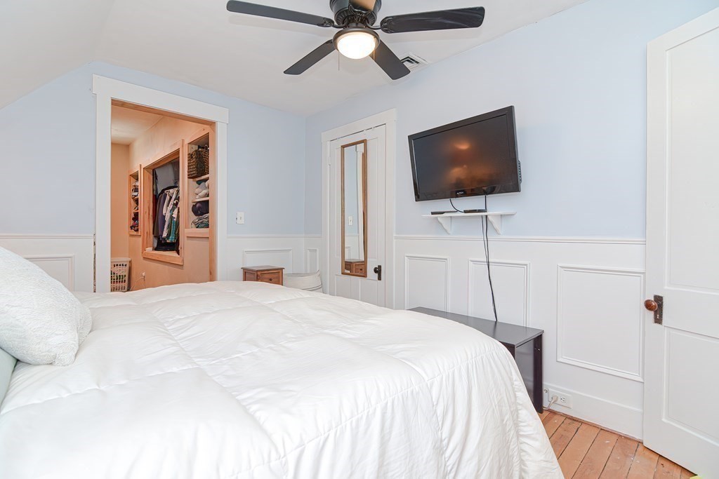 103 Maple Avenue Rutland, MA 01543 - Photo 19 of 42 a bedroom with a bed and a flat screen tv