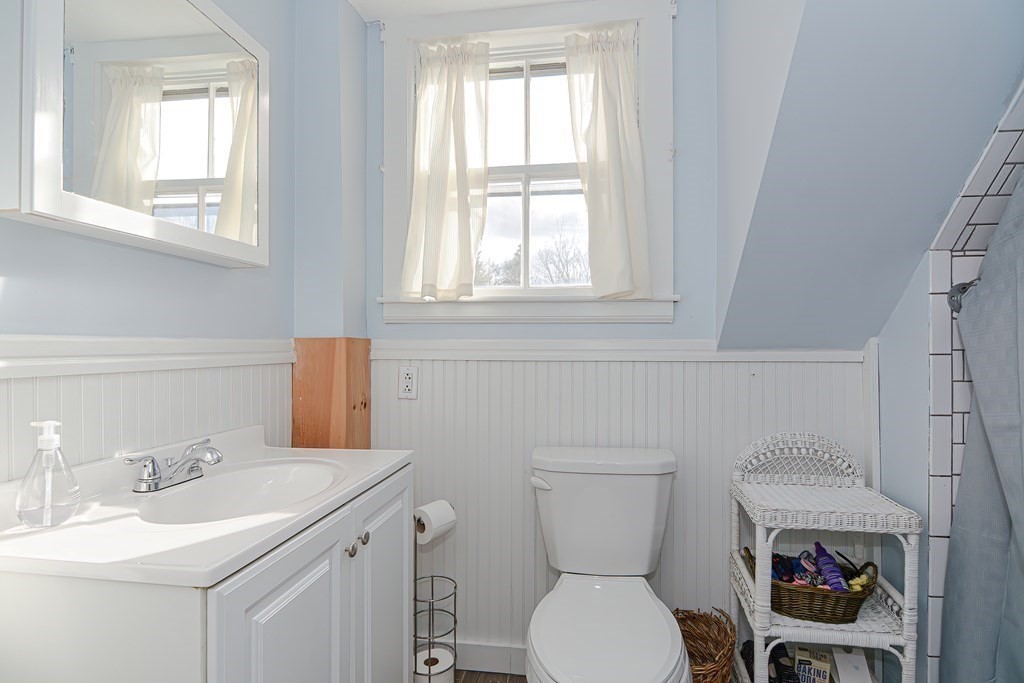 103 Maple Avenue Rutland, MA 01543 - Photo 26 of 42 a bathroom with a toilet a sink and a window