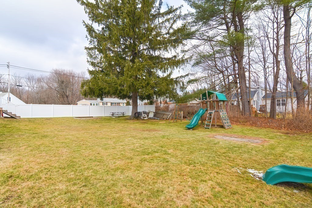 103 Maple Avenue Rutland, MA 01543 - Photo 28 of 42 a view of a swimming pool with an outdoor space and seating area