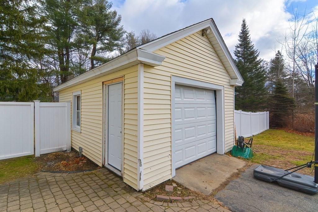 103 Maple Avenue Rutland, MA 01543 - Photo 31 of 42 a view of a small house with backyard