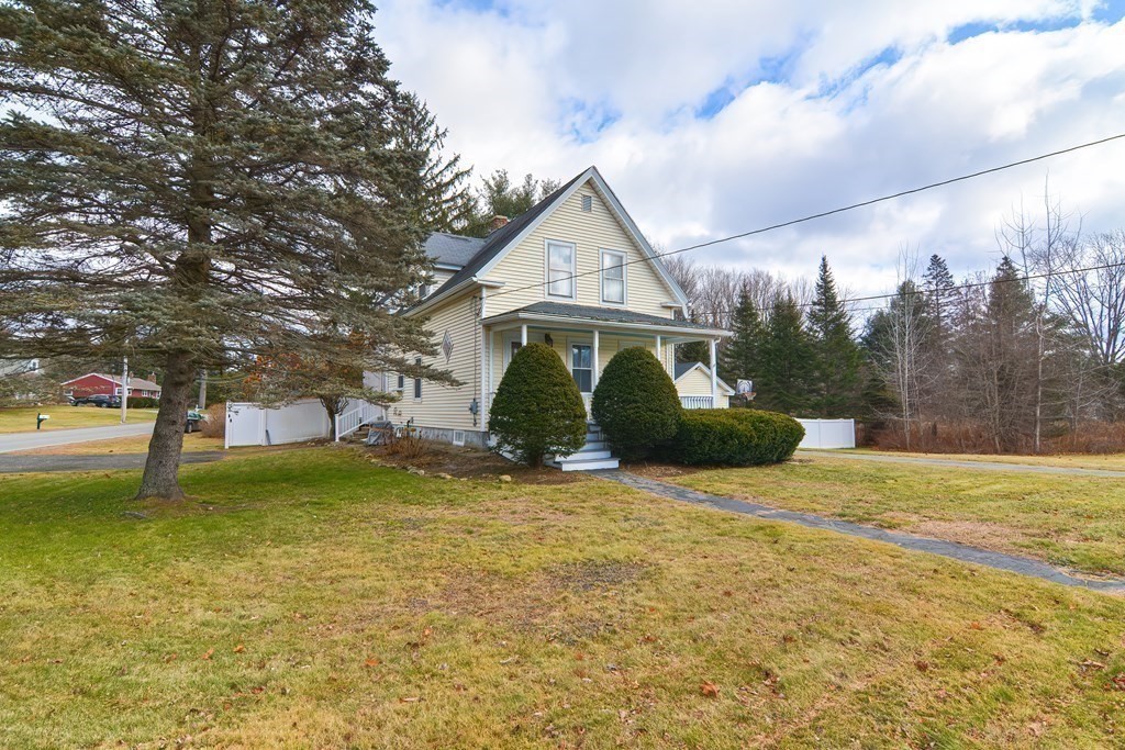 103 Maple Avenue Rutland, MA 01543 - Photo 34 of 42 a view of a house with a yard and large tree