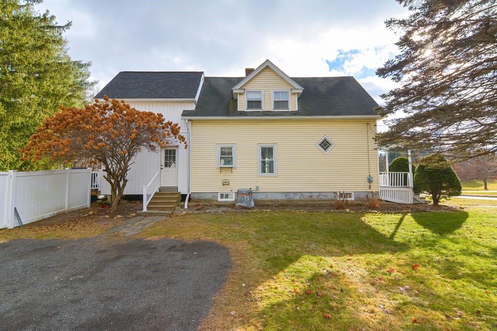 103 Maple Avenue Rutland, MA 01543 - Photo 38 of 42 a view of a house with swimming pool and a yard
