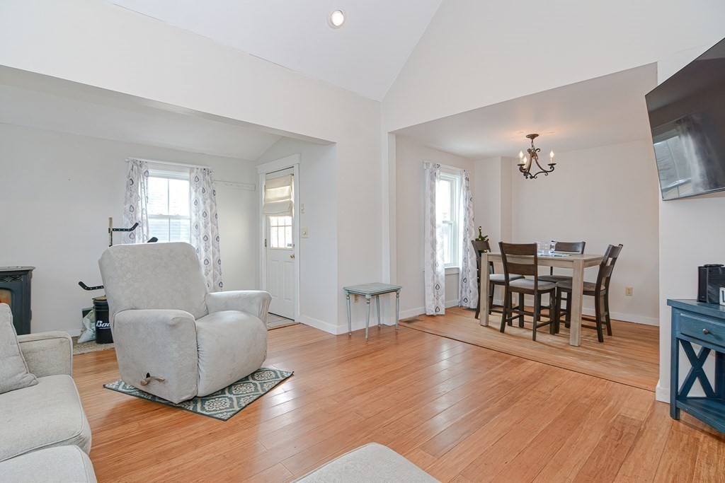 103 Maple Avenue Rutland, MA 01543 - Photo 6 of 42 a living room with furniture and a dining table with wooden floor
