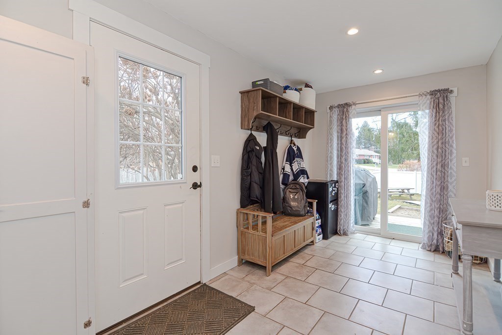103 Maple Avenue Rutland, MA 01543 - Photo 8 of 42 a view of a room with gym equipment and windows