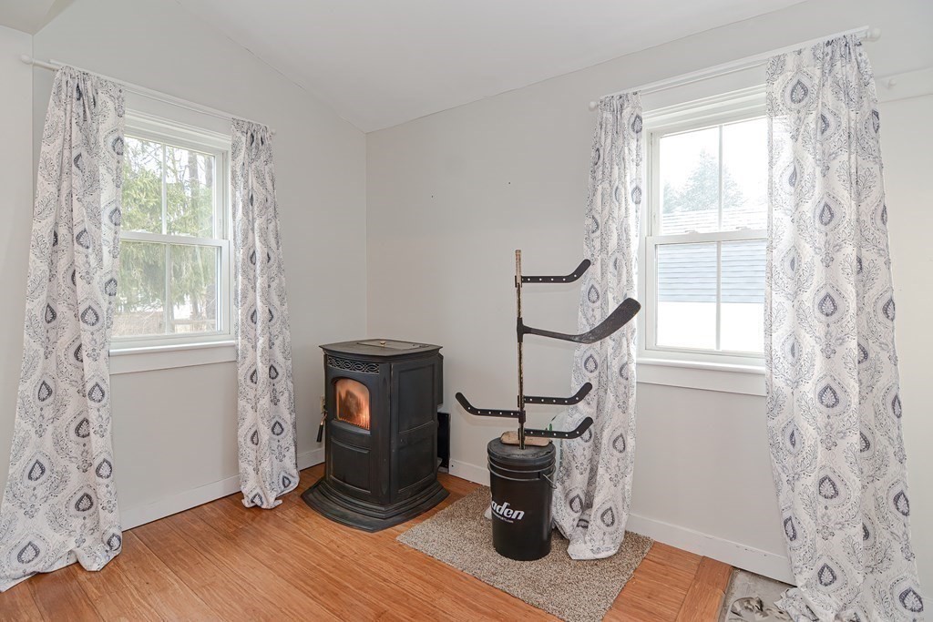103 Maple Avenue Rutland, MA 01543 - Photo 9 of 42 a view of an empty room with wooden floor and a window