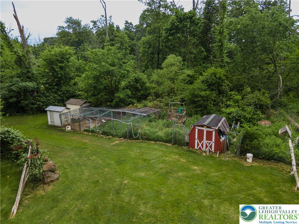 2485 Hieter Road Quakertown, PA 18951 - Photo 77 of 97 A verdant backyard retreat featuring outbuildings and an enclosed area.