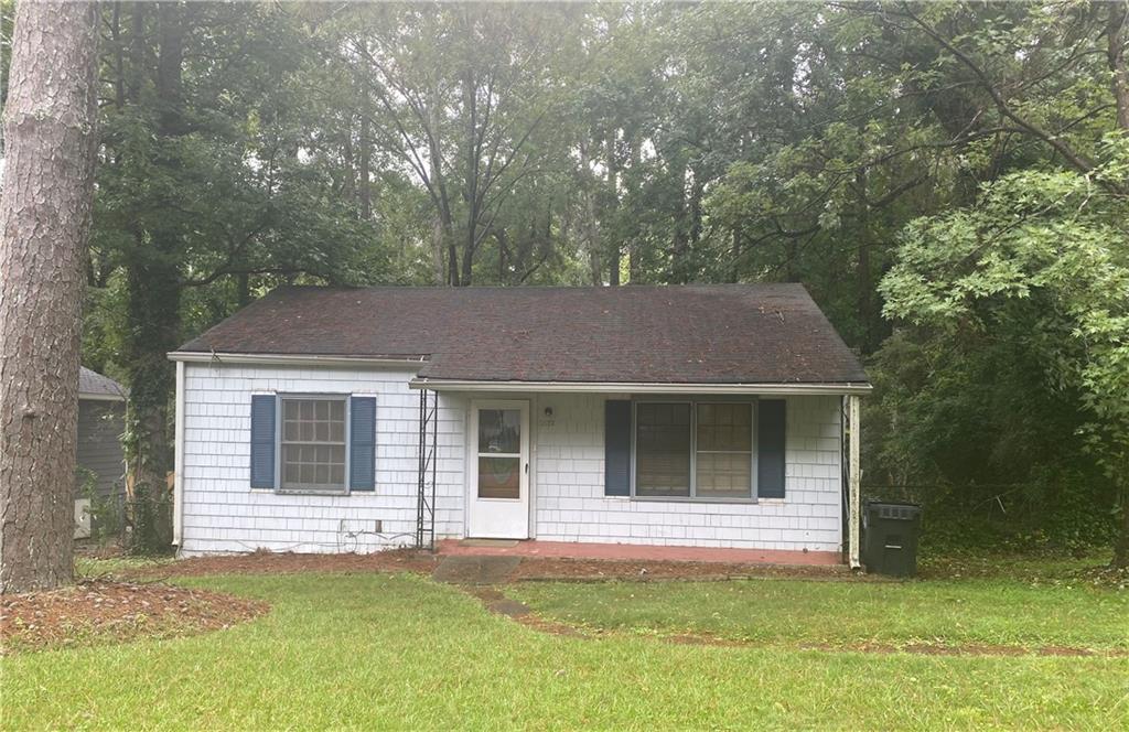 2512 Romain Way East Point, GA 30344 - Photo 1 of 1 a house that has a tree in front of it