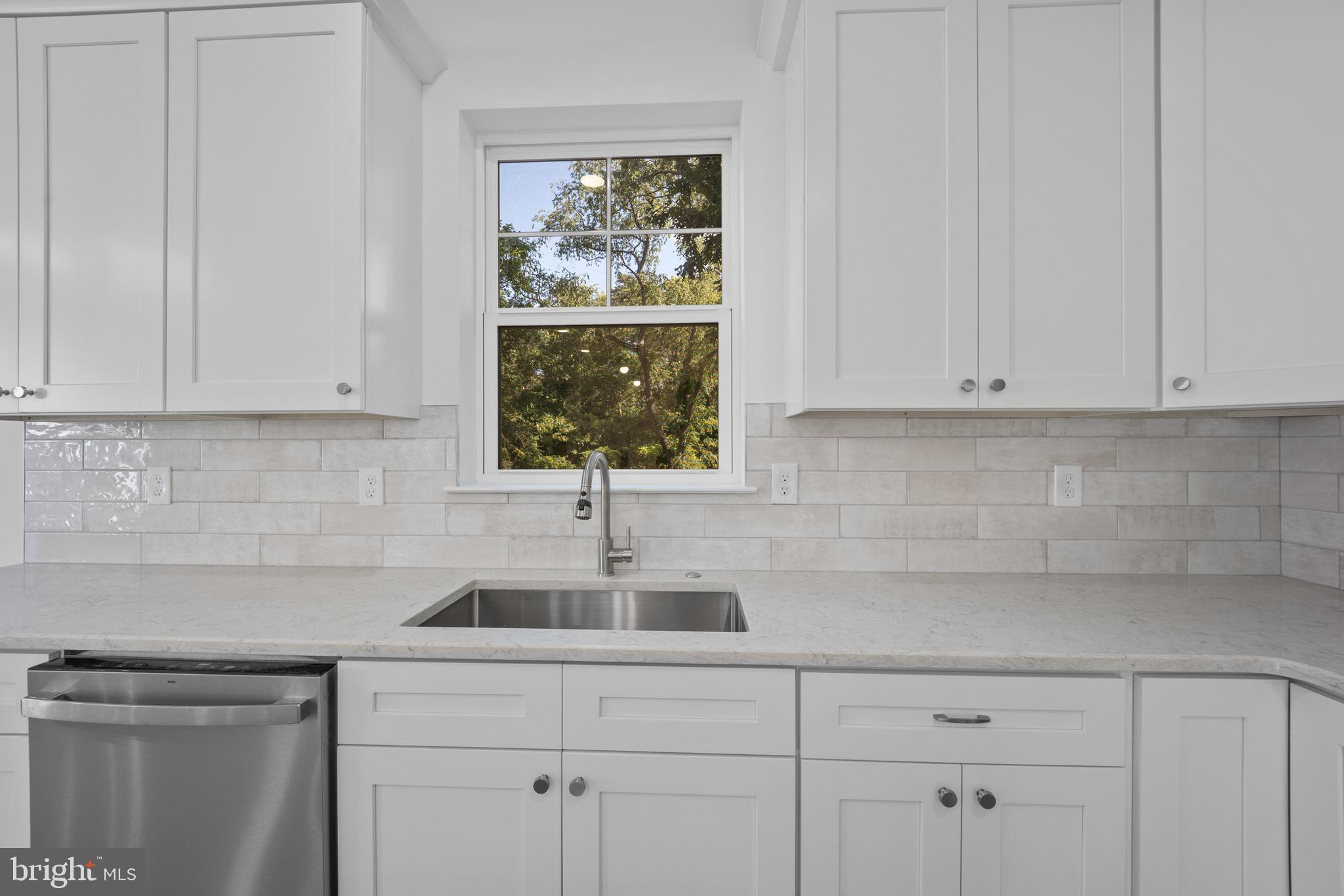 492 Ellis Avenue Lawnside, NJ 08045 - Photo 13 of 33 a kitchen with stainless steel appliances granite countertop white cabinets and a sink