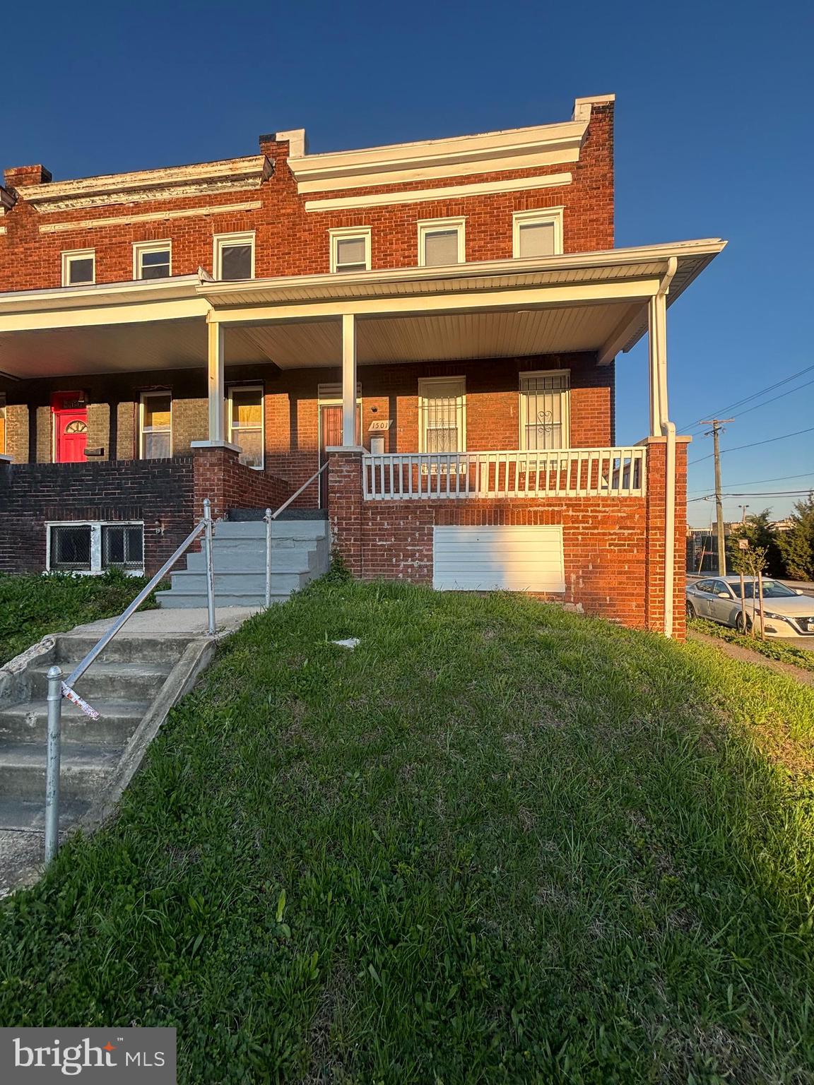 a view of a building with a yard
