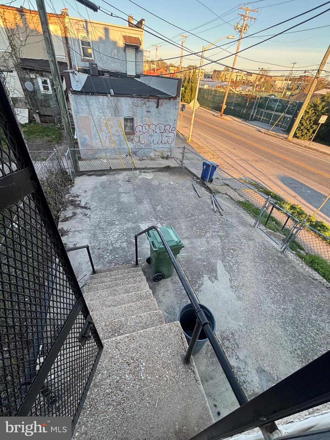 1501 North Payson Street Baltimore, MD 21217 - Photo 13 of 13 a blue bench sitting in front of a building