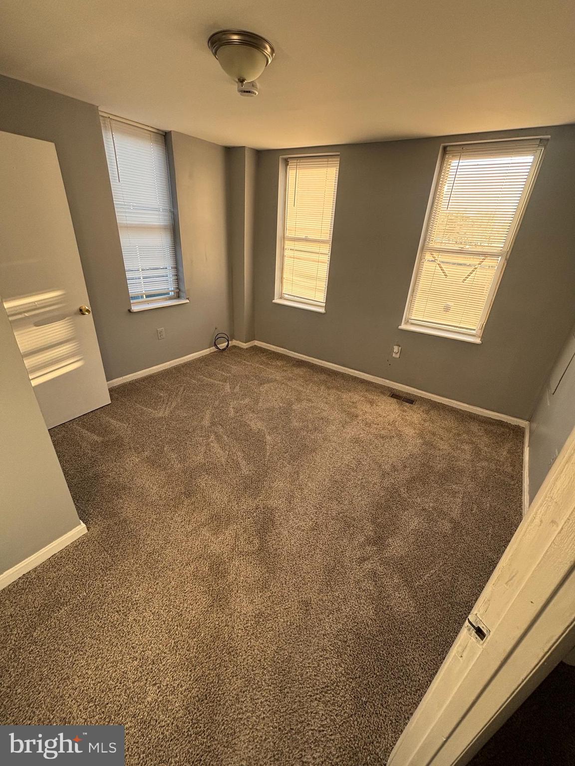 1501 North Payson Street Baltimore, MD 21217 - Photo 7 of 13 a view of an empty room and window