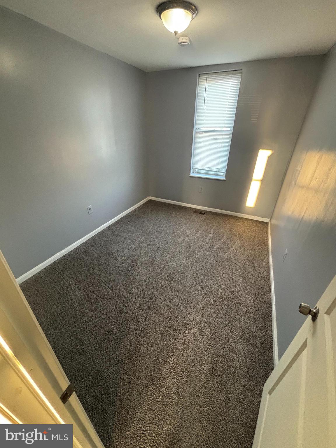 1501 North Payson Street Baltimore, MD 21217 - Photo 9 of 13 a view of an empty room and window