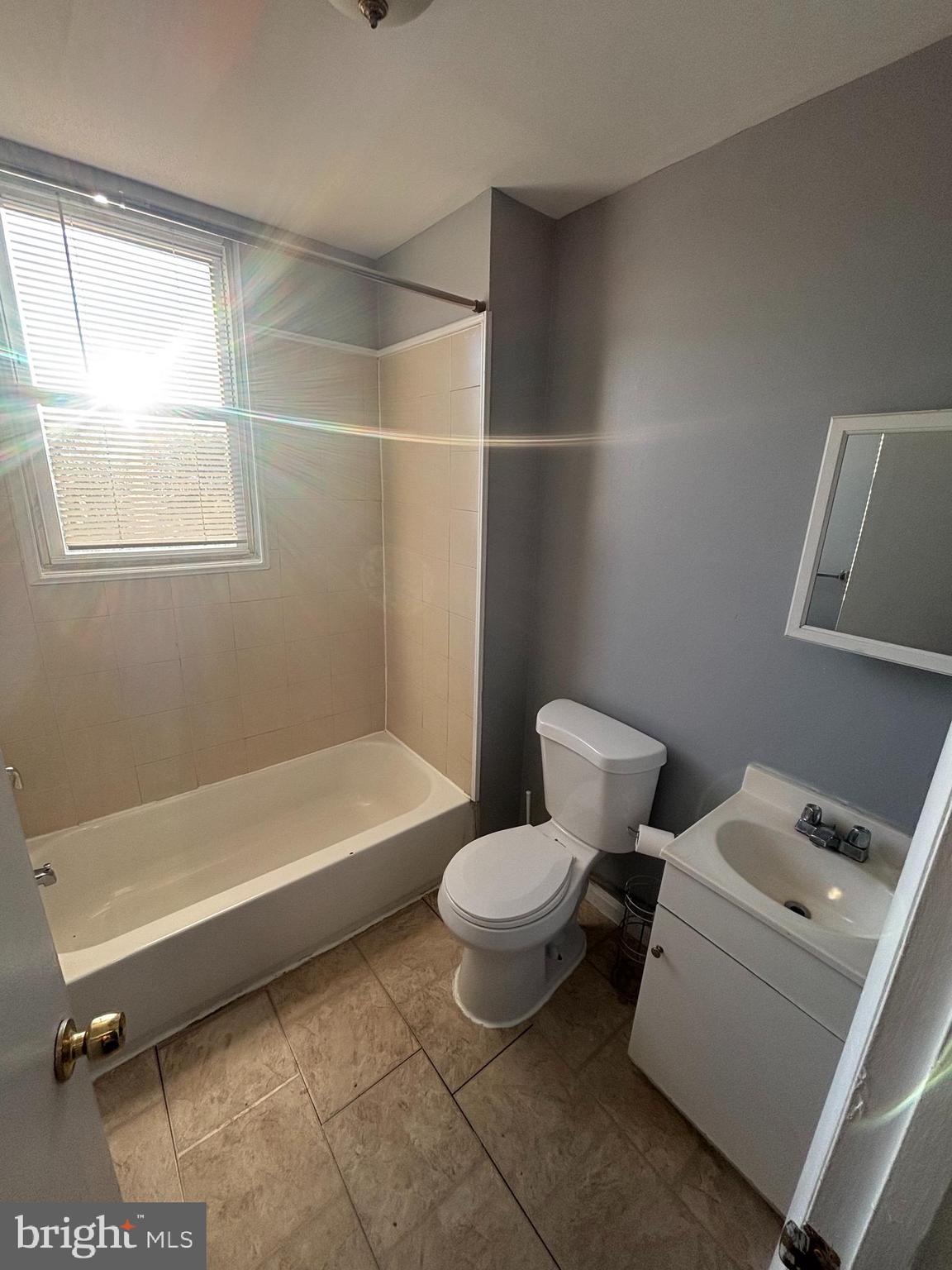 1501 North Payson Street Baltimore, MD 21217 - Photo 10 of 13 a bathroom with a toilet and bathtub