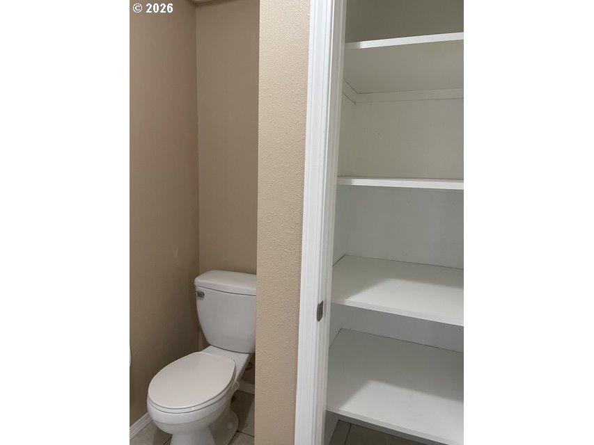 5660 Daisy Street, Unit 31 Springfield, OR 97478 - Photo 25 of 44 a white toilet sitting next to a bathroom sink