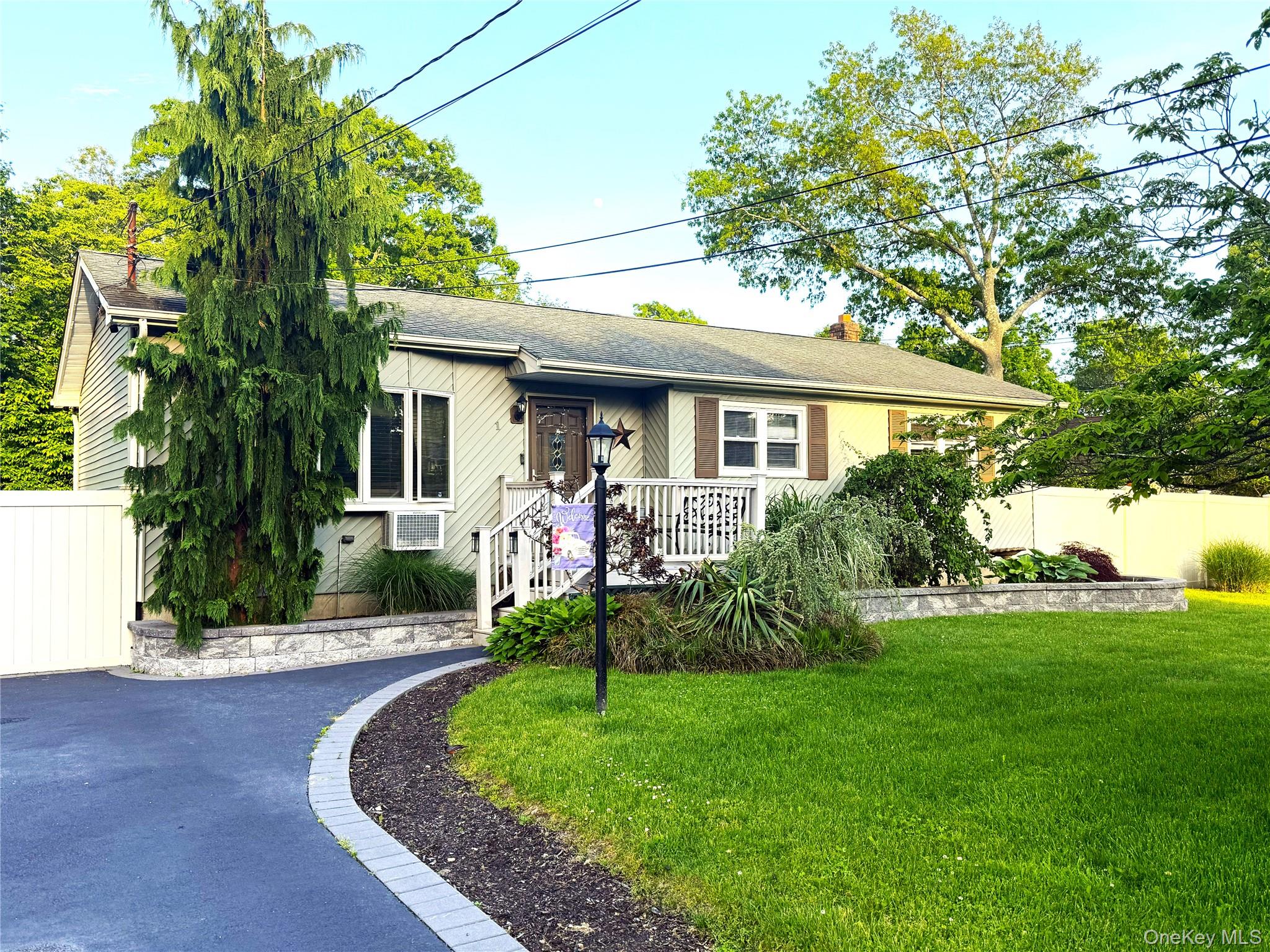 1 Heston Road Shirley, NY 11967 - Photo 1 of 32 Ranch-style residence featuring light-colored siding and a dark roof