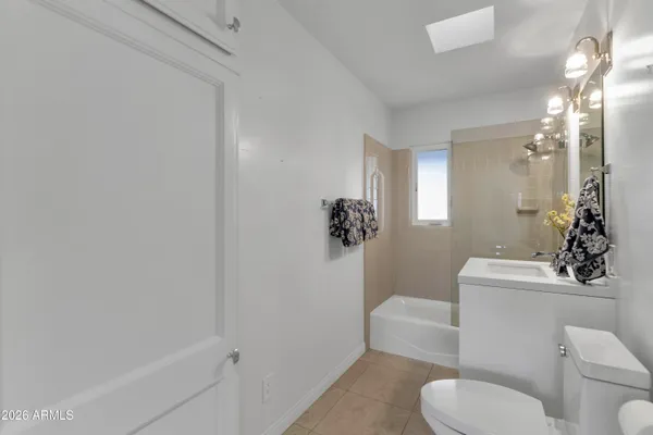 a bathroom with a toilet a sink and bathtub
