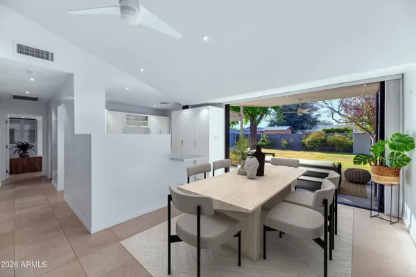 a view of a dining room with furniture window and outside view