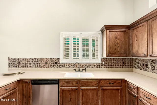 a kitchen with a sink and a window