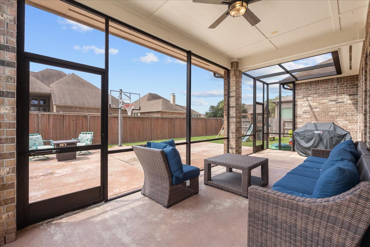 606 West Fork Webster, TX 77598 - Photo 43 of 46 Enjoy year-round outdoor living on this custom 2022 screened-in patio, the perfect bug-free retreat in this Edgewater, Webster home.