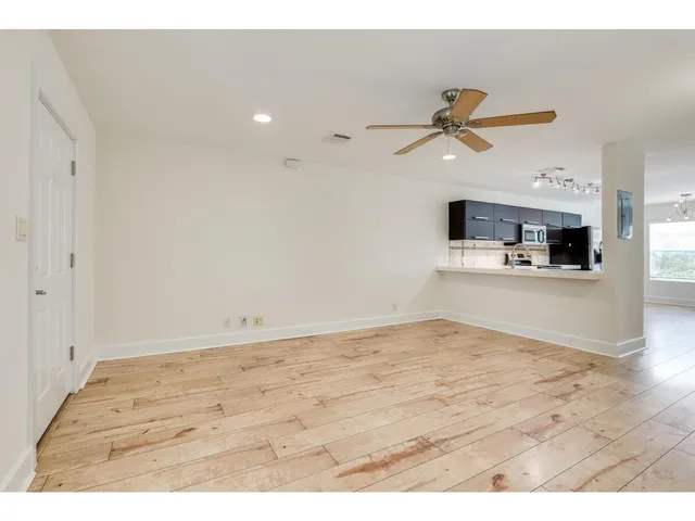 a view of kitchen with cabinets