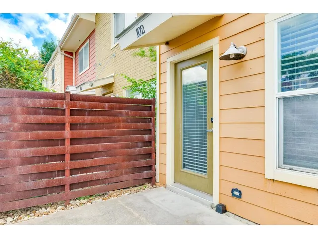 a view of a house with a yard and plants