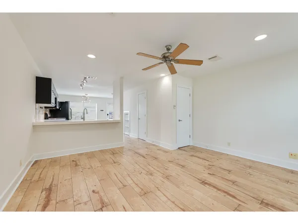 a view of kitchen with wooden floor and window