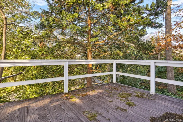 a backyard of a house with a yard and outdoor seating