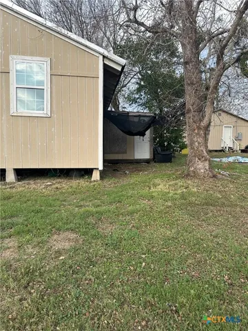 a view of a back yard of the house