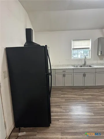 a view of kitchen with wooden floor