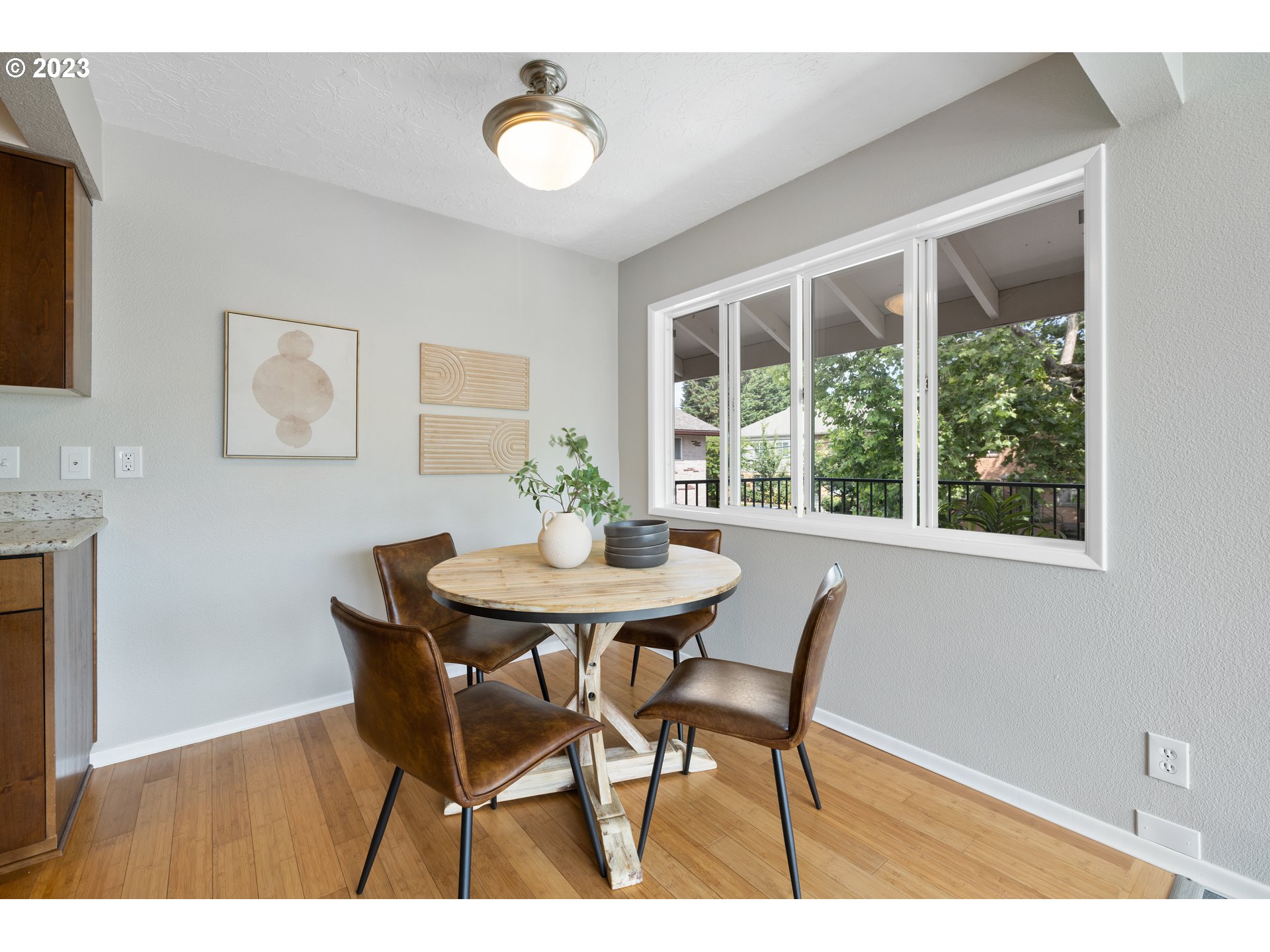 2038 Northeast Clackamas Street Portland, OR 97232 - Photo 15 of 32 a view of a dining room with furniture and wooden floor