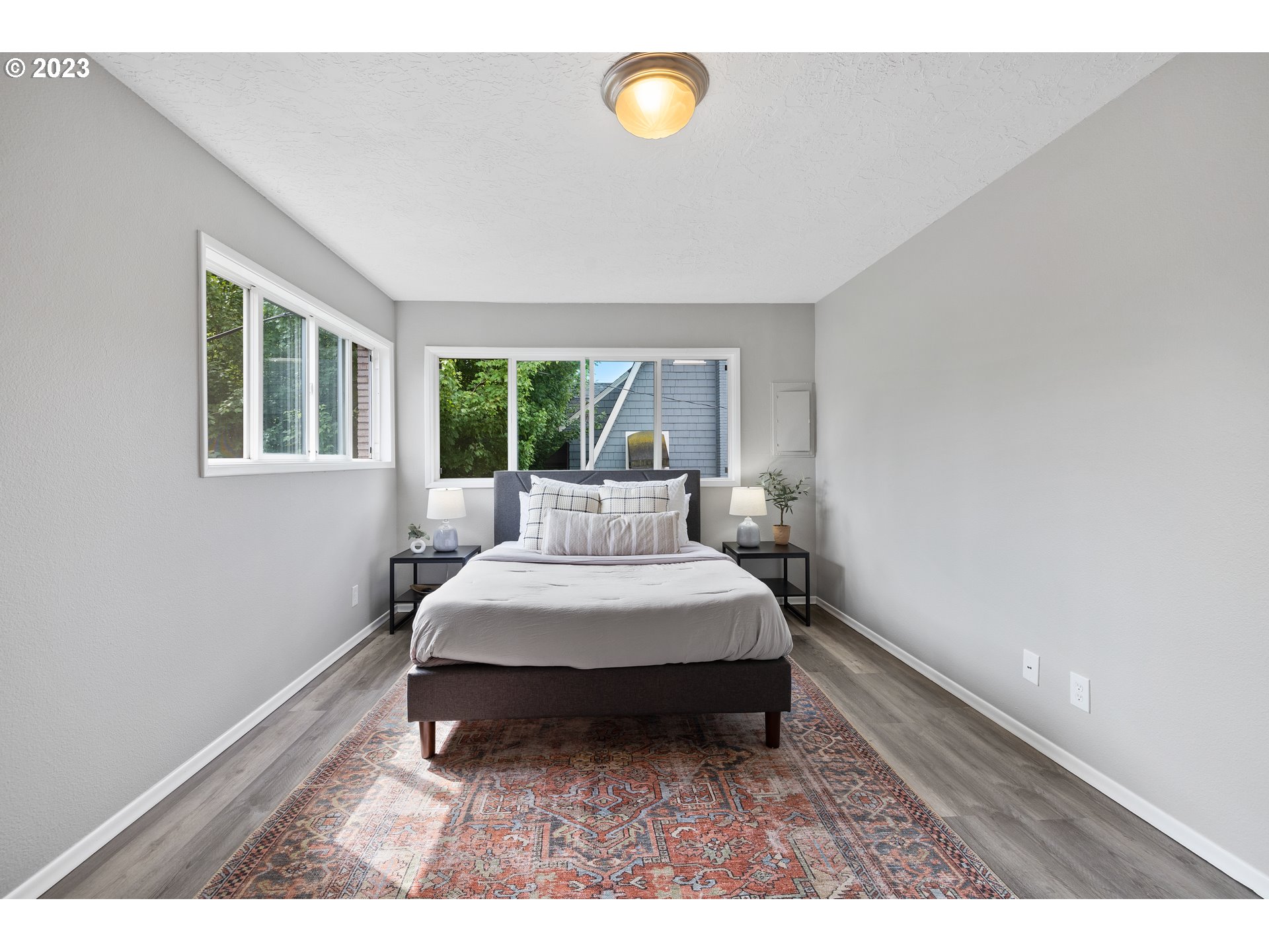2038 Northeast Clackamas Street Portland, OR 97232 - Photo 22 of 32 a bedroom with a bed and window