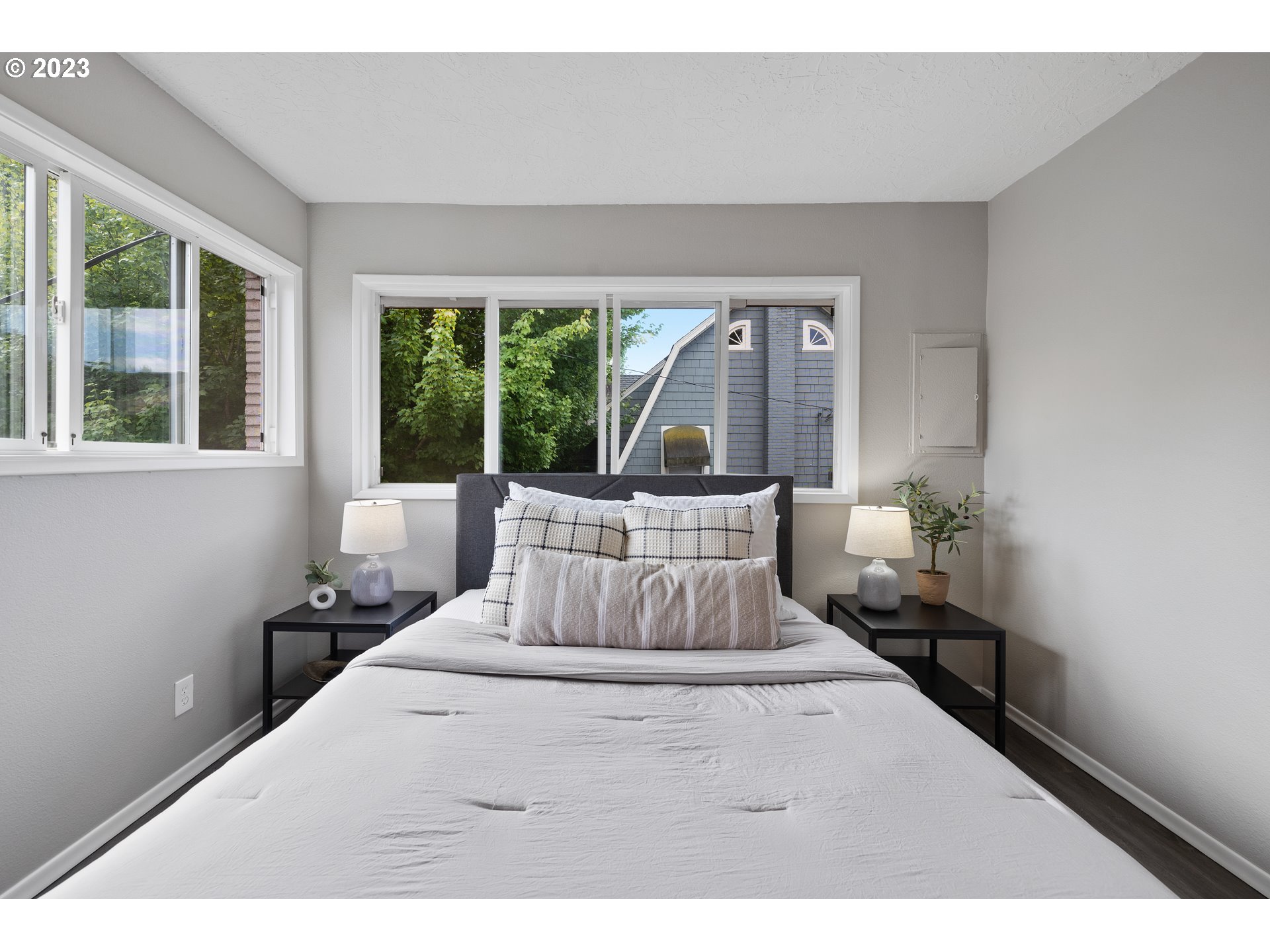 2038 Northeast Clackamas Street Portland, OR 97232 - Photo 23 of 32 a bedroom with a bed and large windows