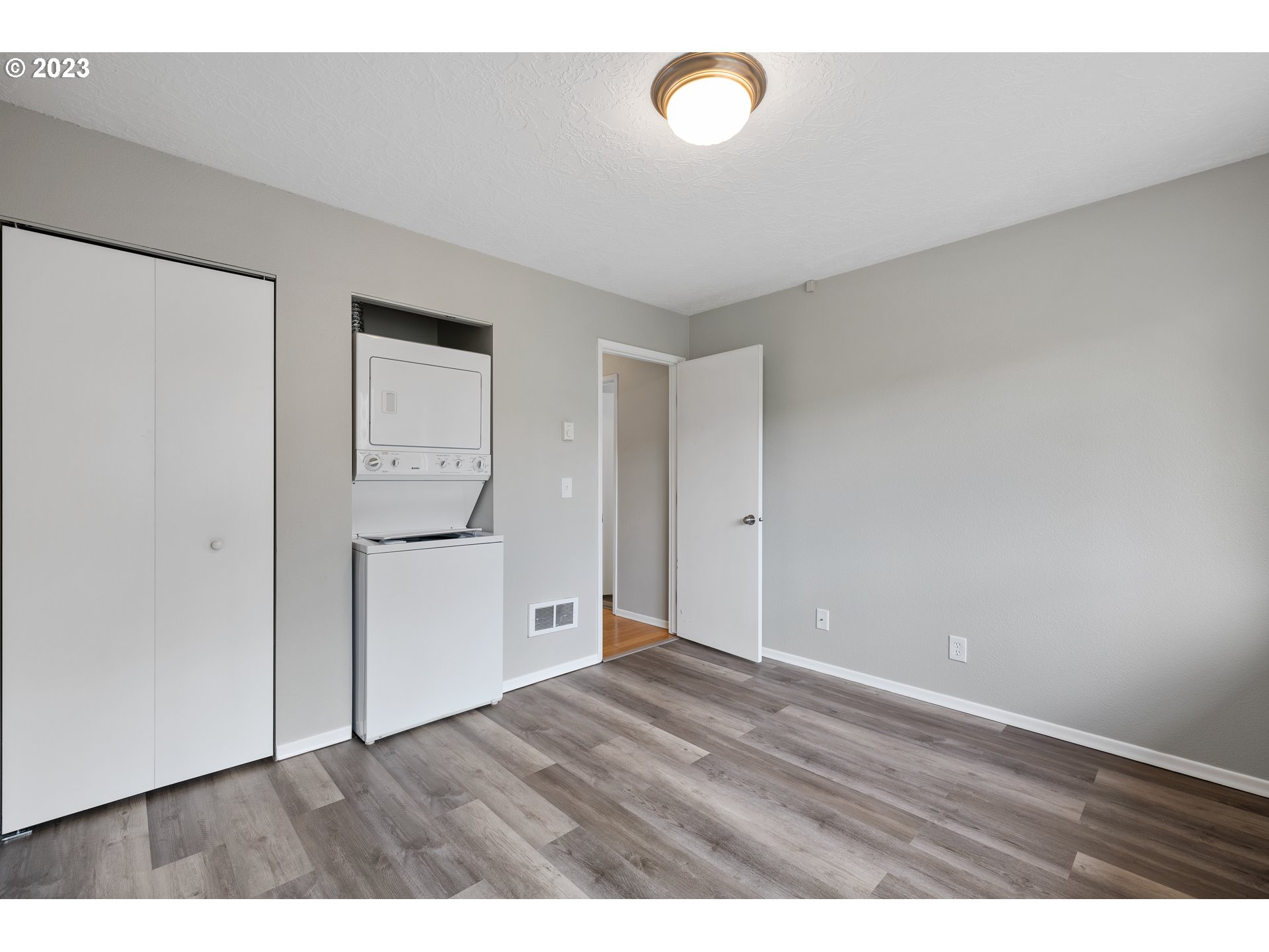 2038 Northeast Clackamas Street Portland, OR 97232 - Photo 27 of 32 a view of an empty room with wooden floor