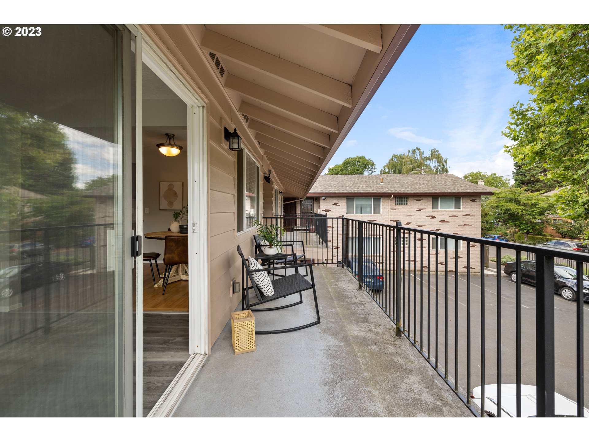 2038 Northeast Clackamas Street Portland, OR 97232 - Photo 29 of 32 a view of a balcony with chairs and a potted plant