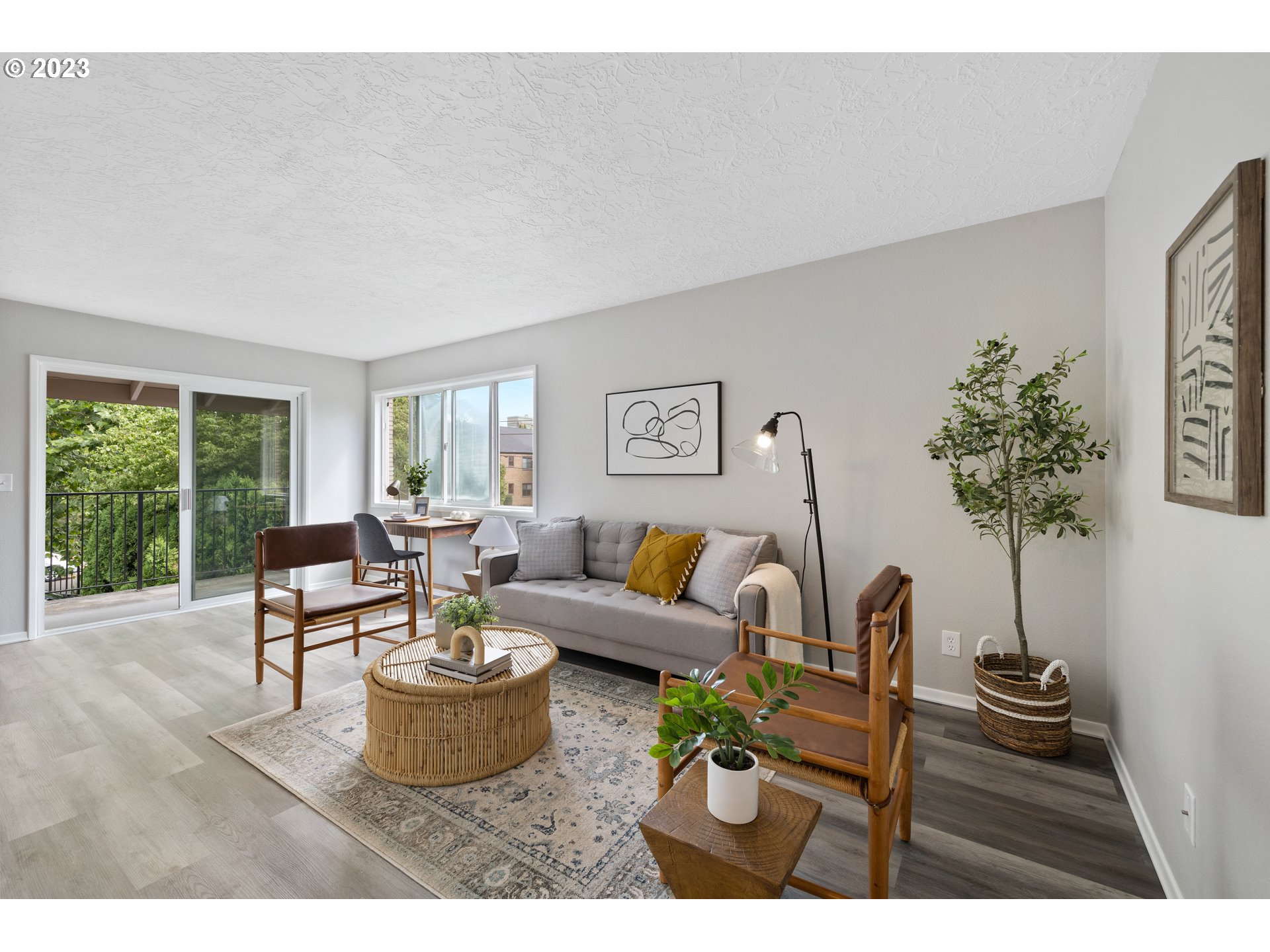 2038 Northeast Clackamas Street Portland, OR 97232 - Photo 5 of 32 a living room with furniture potted plant and a large window