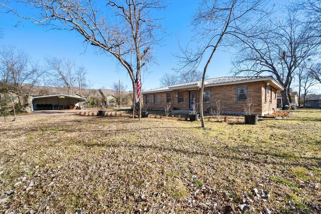448 South Bateman Road Fairfield, TX 75840 - Photo 17 of 24 a view of a yard with wooden fence