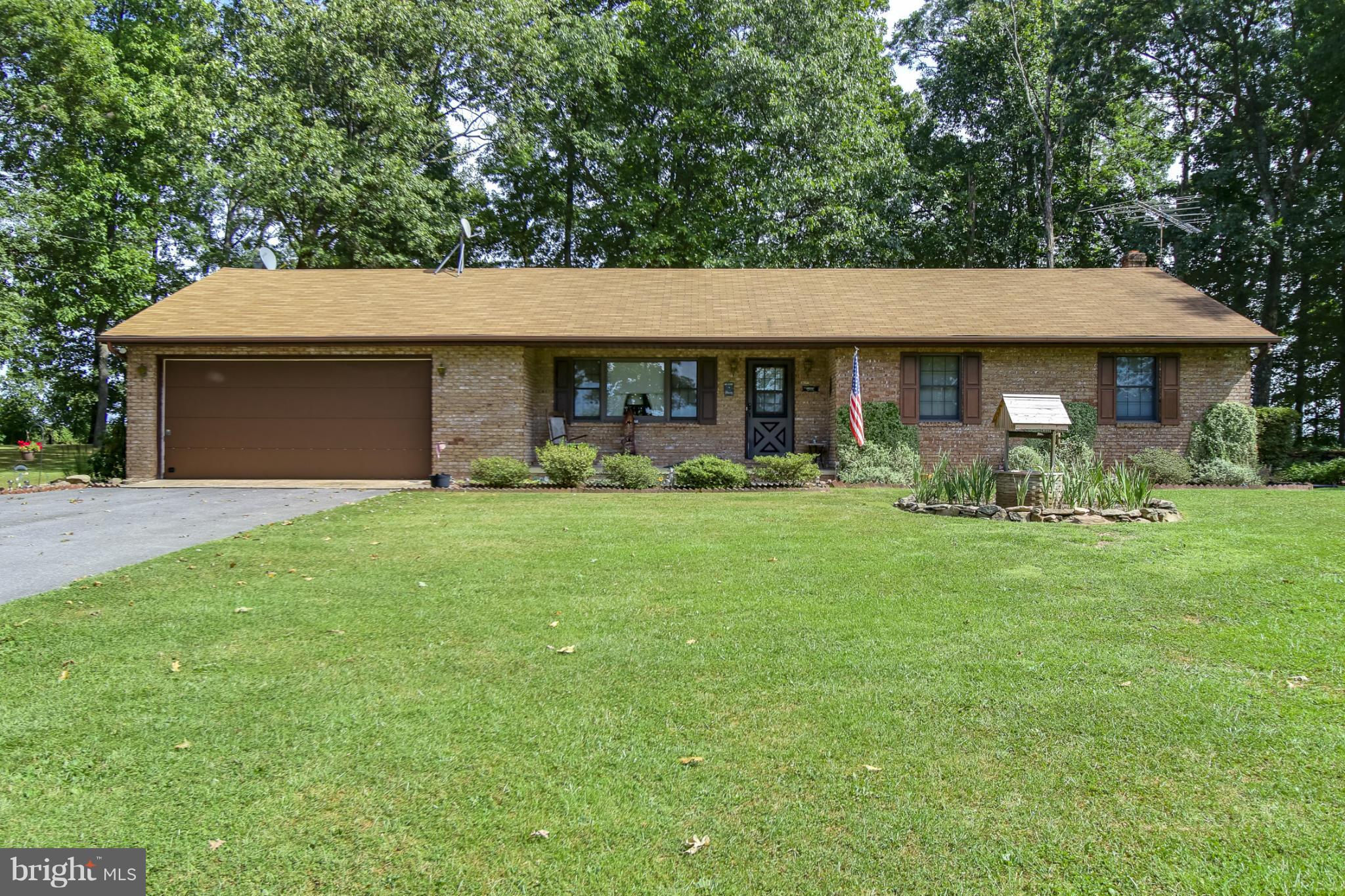 4355 Ruggles Road Taneytown, MD 21787 - Photo 1 of 27 a front view of a house with garden
