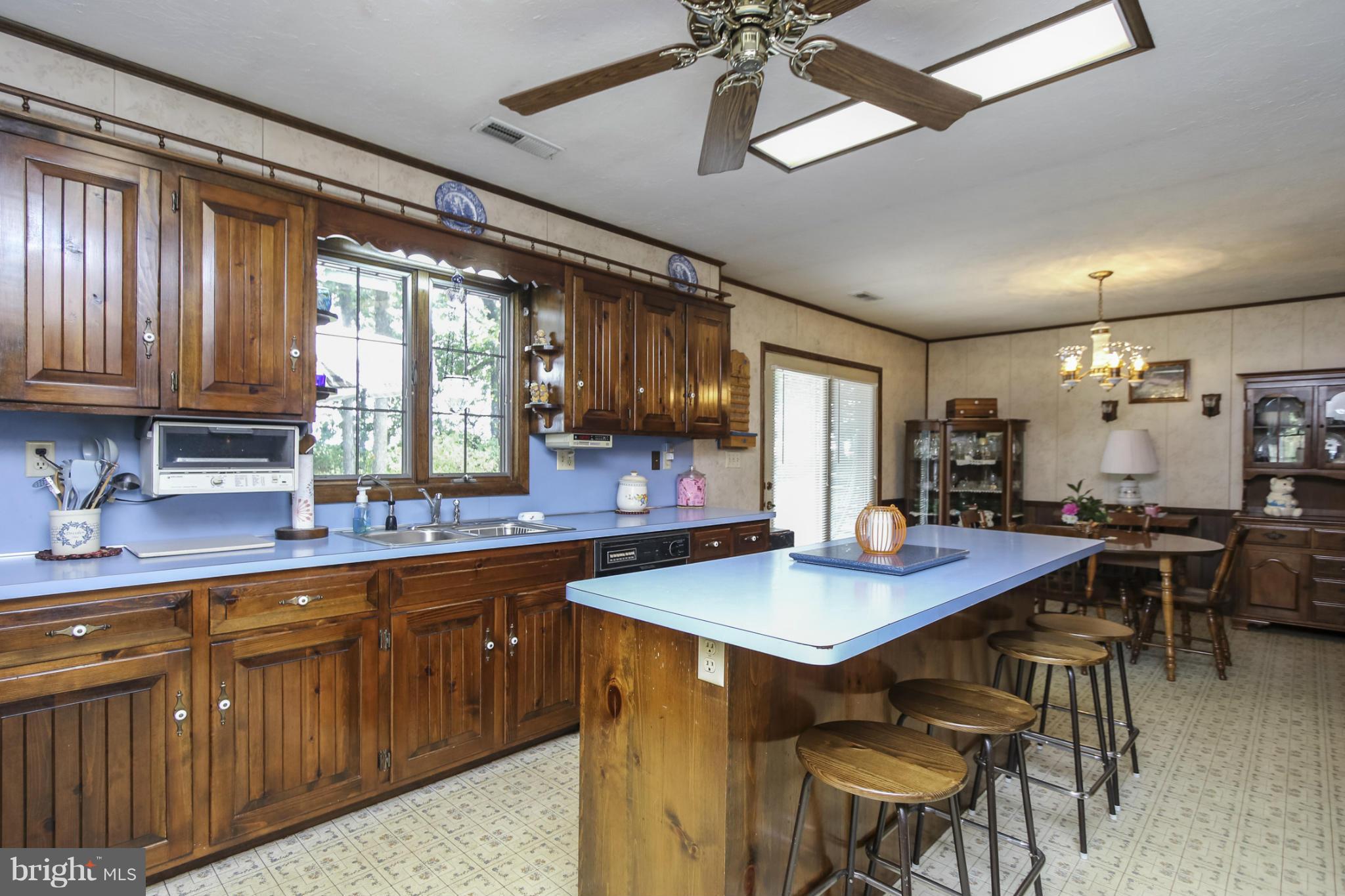 4355 Ruggles Road Taneytown, MD 21787 - Photo 3 of 27 a kitchen with lots of counter top space and dining table