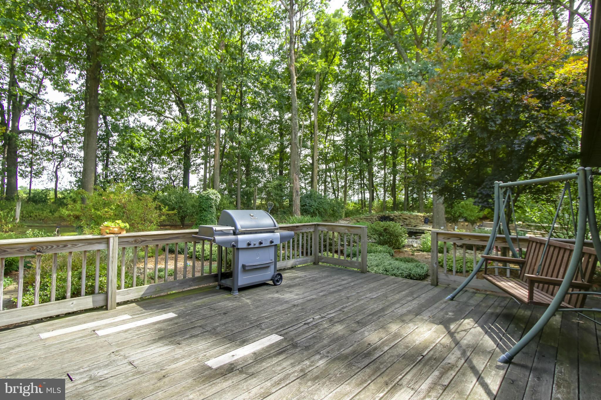 4355 Ruggles Road Taneytown, MD 21787 - Photo 22 of 27 a view of a balcony with chair and wooden fence